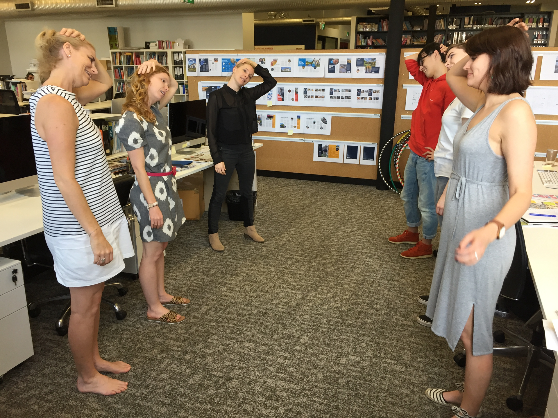 A group of women exercising in the office